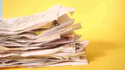 A pile of receipts is taken out of pockets and added to the mail sorting pile each day.