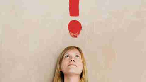 ADHD test. A woman in a green shirt stares up at an imaginary red question mark and wonders, 'Do I have adhd?' She takes the ADD test for adults.