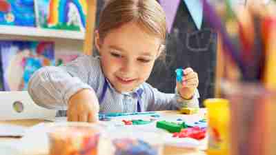 A child with ADHD working on an art therapy project.
