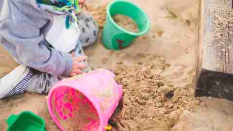 Child with EFD playing in sandbox