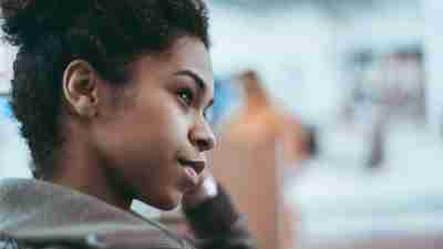 A woman with executive function problems looks into the distance.