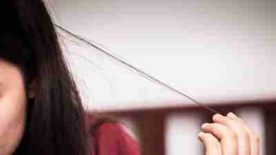 Teen hair pulling disorder or Trichotillomania mental problem stress worry girl.
