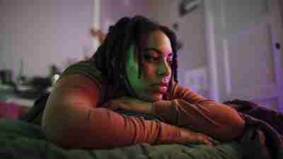 Untreated ADHD triggers depression and anxiety in this woman in bed