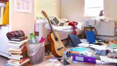 A teenage girls untidy bedroom.