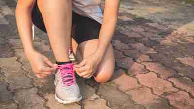 A woman prepares to go running to outsmart the link between ADHD and obesity.